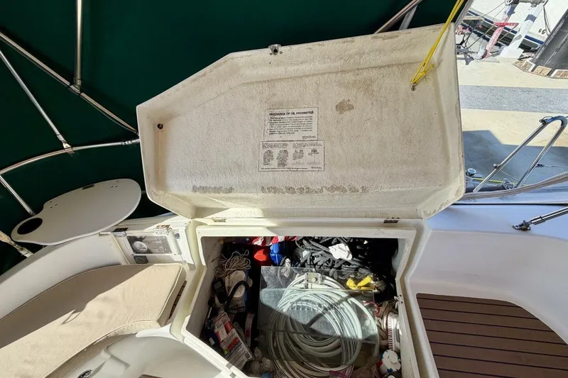 Slide: The Image of Storage compartment on a 2000 Beneteau Oceanis 461 sailboat, filled with nautical gear. - 62