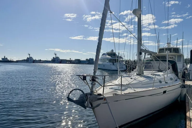 Slide: The Image of 2000 Beneteau Oceanis 461 sailboat docked in sunny marina with clear skies. - 65