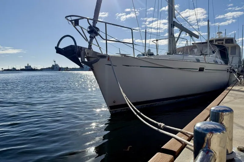 Slide: The Image of Sailboat Beneteau Oceanis 461, 2000 model, docked at marina under clear blue sky. - 68