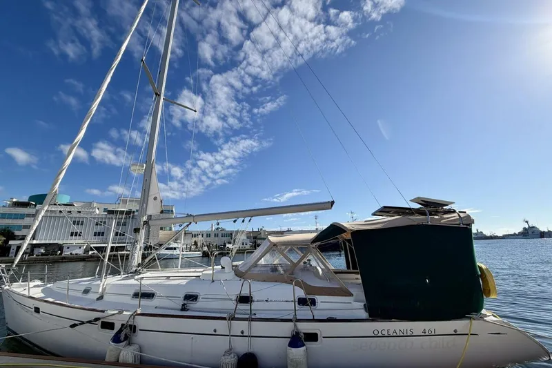 Slide: The Image of Beneteau Oceanis 461 sailboat docked, 2000 model, under a clear blue sky. - 74