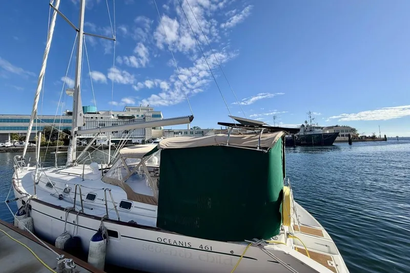 Slide: The Image of 2000 Beneteau Oceanis 461 sailboat docked in a sunny marina. - 75