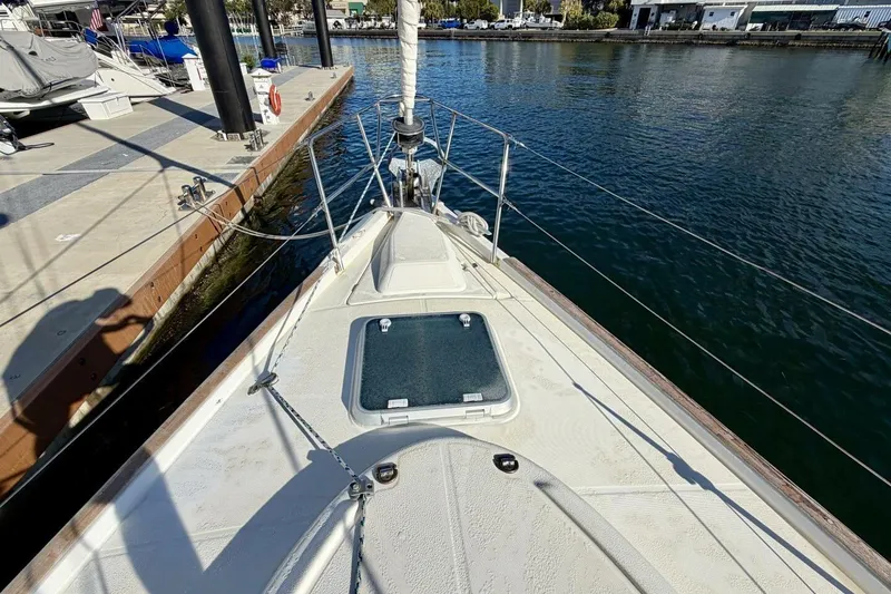 Slide: The Image of Beneteau Oceanis 461 sailboat deck, docked at marina, sunny day, 2000 model. - 85
