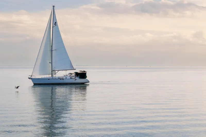 Slide: The Image of Sailing yacht Beneteau Oceanis 461, 2000 model, gliding on calm waters at sunset. - 89