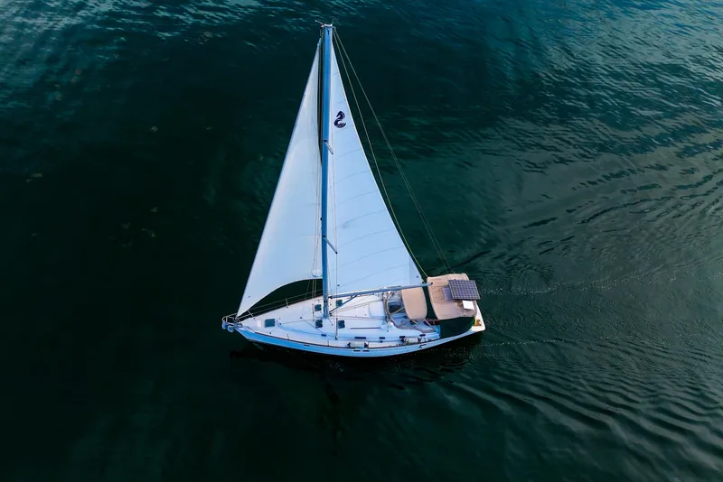Slide: The Image of Beneteau Oceanis 461 sailboat from 2000 gliding on calm waters, aerial view. - 92