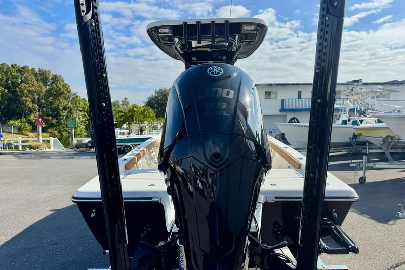 Slide: The Image of 2026 Key West 230 Bay Reef boat with powerful Yamaha V6 engine in marina setting. - 11