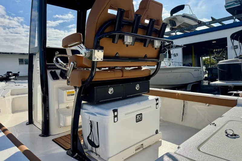 Slide: The Image of 2026 Key West 230 Bay Reef boat interior with seating and storage. - 14