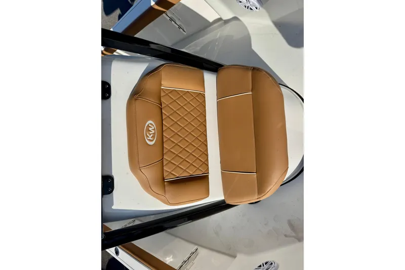 Slide: The Image of Tan leather seating on 2026 Key West 230 Bay Reef boat, featuring diamond stitching. - 29