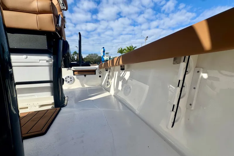 Slide: The Image of 2026 Key West 230 Bay Reef boat interior with tan seating and white deck. - 34