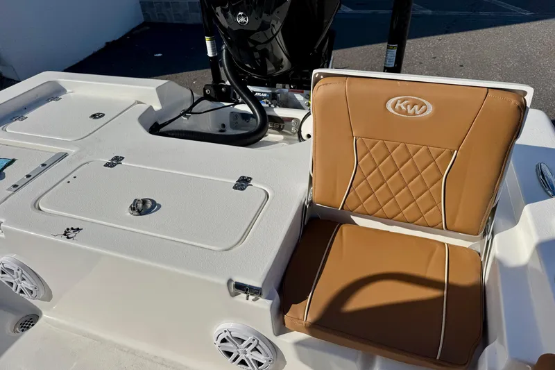Slide: The Image of 2026 Key West 230 Bay Reef boat seat with tan upholstery and KW logo. - 38