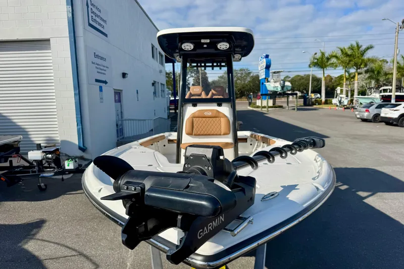 Slide: The Image of 2026 Key West 230 Bay Reef boat with Garmin equipment, parked outside a service department. - 4