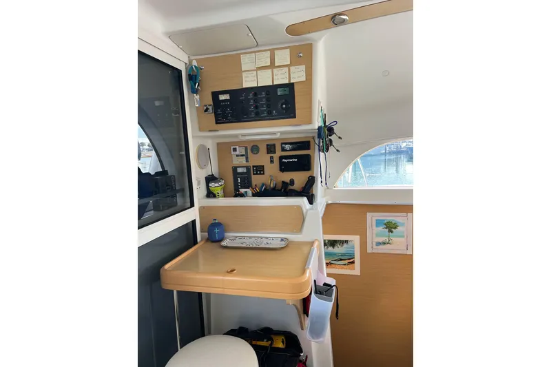 Slide: The Image of Cozy cabin interior of 2012 Lagoon 380 S2 with pillows, bags, and supplies. - 10