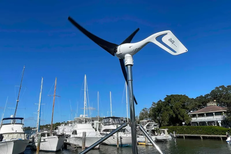 Slide: The Image of Wind turbine on Lagoon 380 S2 catamaran, docked at marina, clear blue sky. - 104