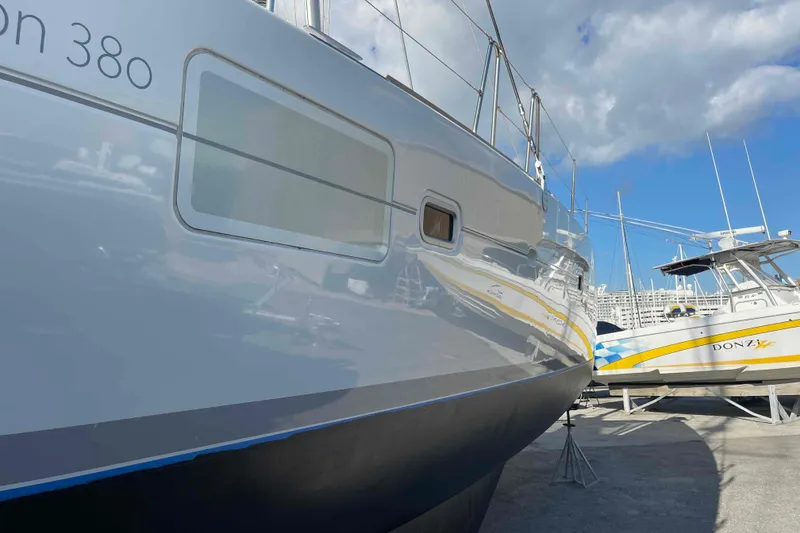 Slide: The Image of Lagoon 380 S2 catamaran interior, 2012 model, docked with clear sky and water view. - 18