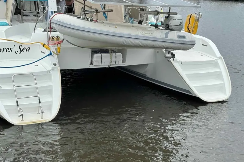Slide: The Image of Cockpit view of 2012 Lagoon 380 S2 catamaran with steering wheel and navigation equipment. - 27