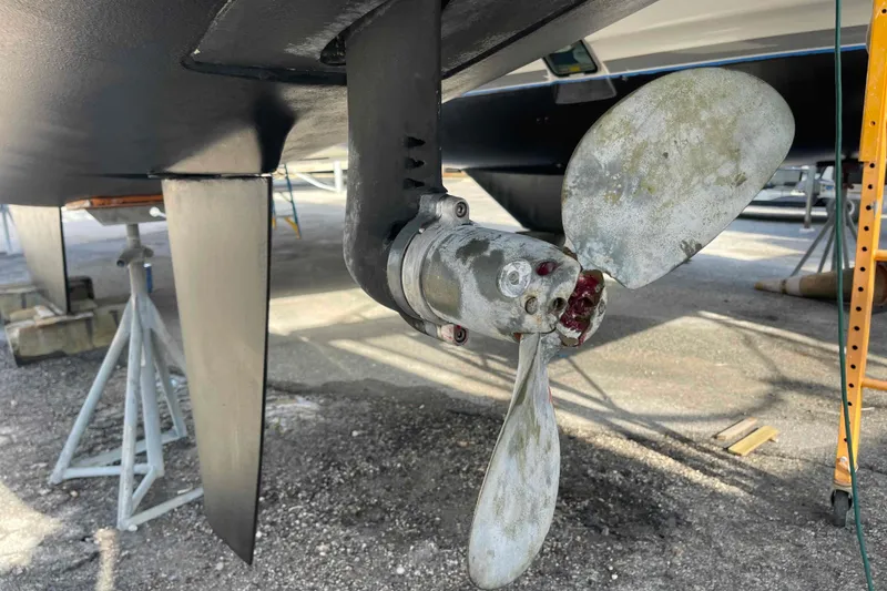 Slide: The Image of Cozy cabin interior of 2012 Lagoon 380 S2 catamaran with bed and porthole window. - 34