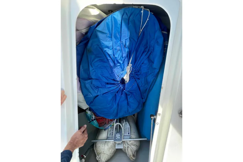 Slide: The Image of Interior of 2012 Lagoon 380 S2 yacht with supplies and bedding neatly arranged. - 48