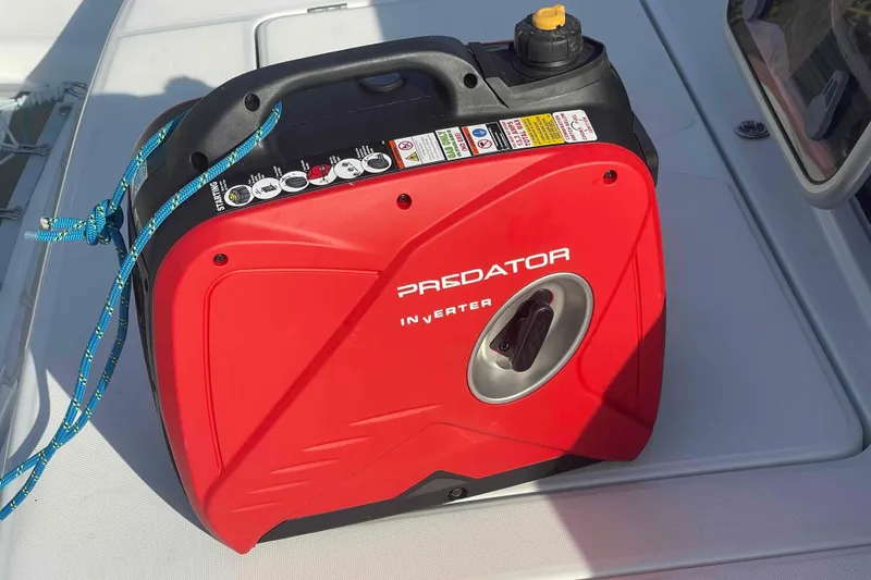 Slide: The Image of 2012 Lagoon 380 S2 catamaran on dry dock under clear blue sky. - 51