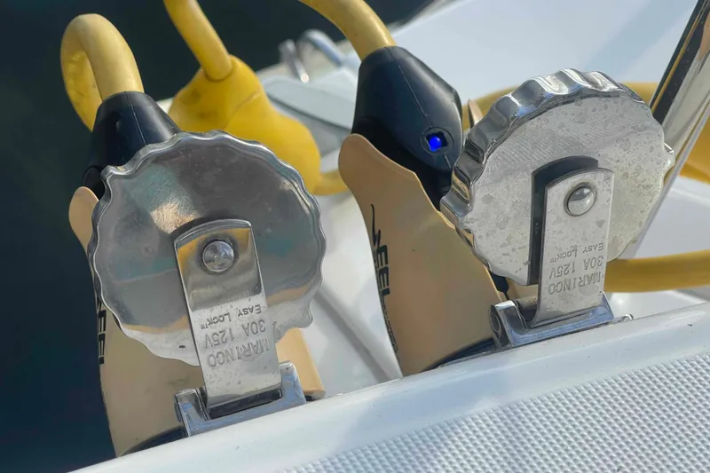 Slide: The Image of 2012 Lagoon 380 S2 catamaran on dry dock with ladder for maintenance. - 54