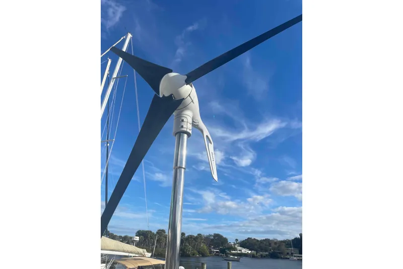 Slide: The Image of Propeller of 2012 Lagoon 380 S2 catamaran on dry dock, showing wear and maintenance needs. - 61