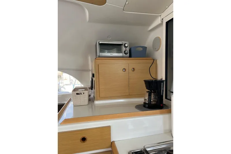 Slide: The Image of Compact bathroom in 2012 Lagoon 380 S2 yacht with sink, toilet, and mirror. - 9