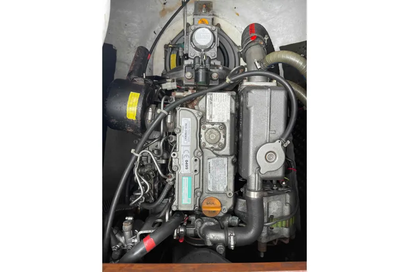 Slide: The Image of Engine of a 2012 Lagoon 380 S2 catamaran, showcasing mechanical components. - 91