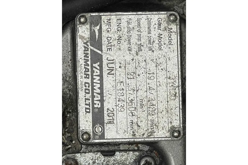 Slide: The Image of Yanmar engine plate on Lagoon 380 S2, 2012 model, showing specifications and manufacturing details. - 92