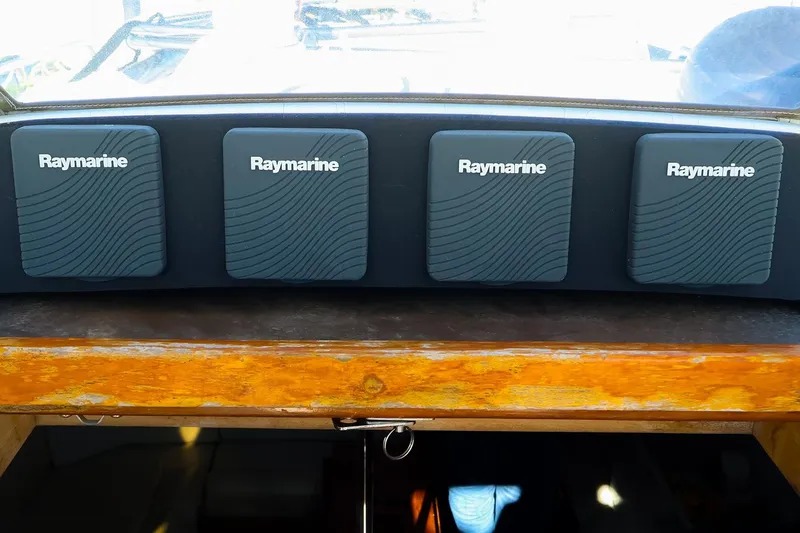Slide: The Image of Raymarine instruments on 2004 J Boats J/46 yacht dashboard. - 12