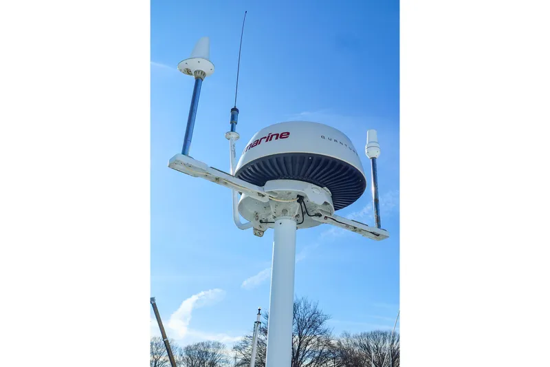 Slide: The Image of Radar and antennas on a 2004 J Boats J/46 sailboat against a clear blue sky. - 19