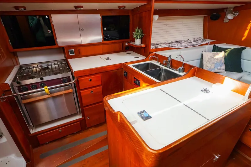 Slide: The Image of Luxurious 2004 J Boats J/46 yacht interior with modern kitchen and cozy seating area. - 27