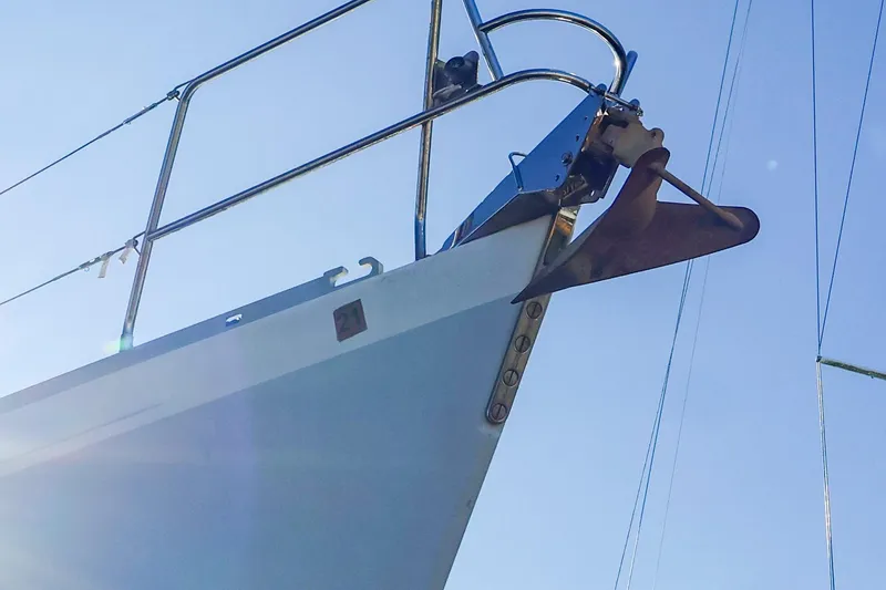 Slide: The Image of Bow of 2004 J Boats J/46 sailboat with anchor under clear sky. - 3