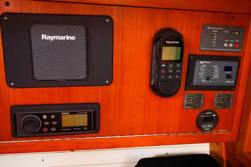 Slide: The Image of Control panel of a 2004 J Boats J/46 with Raymarine and Fusion equipment. - 30
