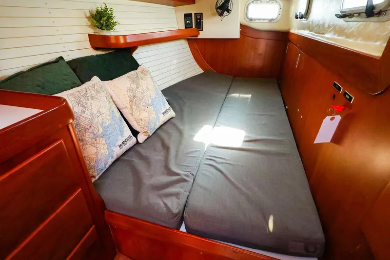 Slide: The Image of Cozy cabin interior of 2004 J Boats J/46 with comfortable bedding and nautical decor. - 38