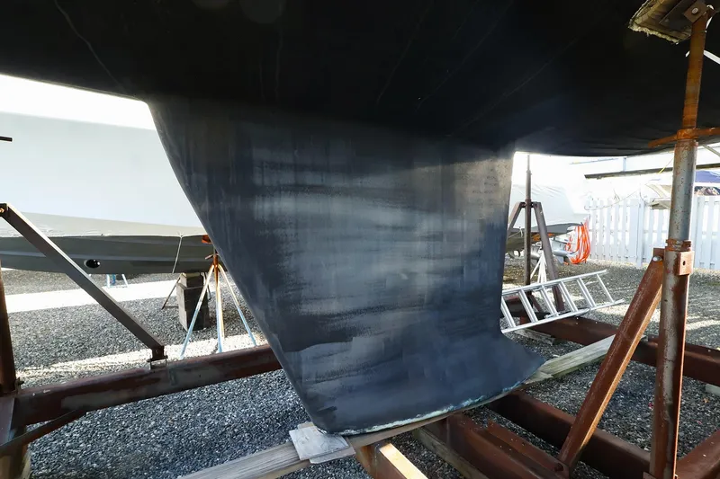 Slide: The Image of 2004 J Boats J/46 sailboat keel on dry dock with support stands. - 4