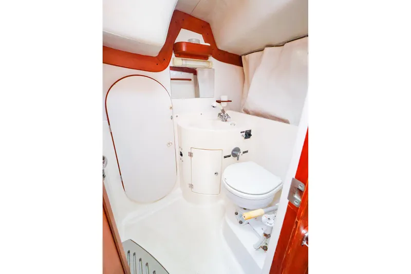 Slide: The Image of 2004 J Boats J/46 yacht bathroom with compact design and white fixtures. - 40
