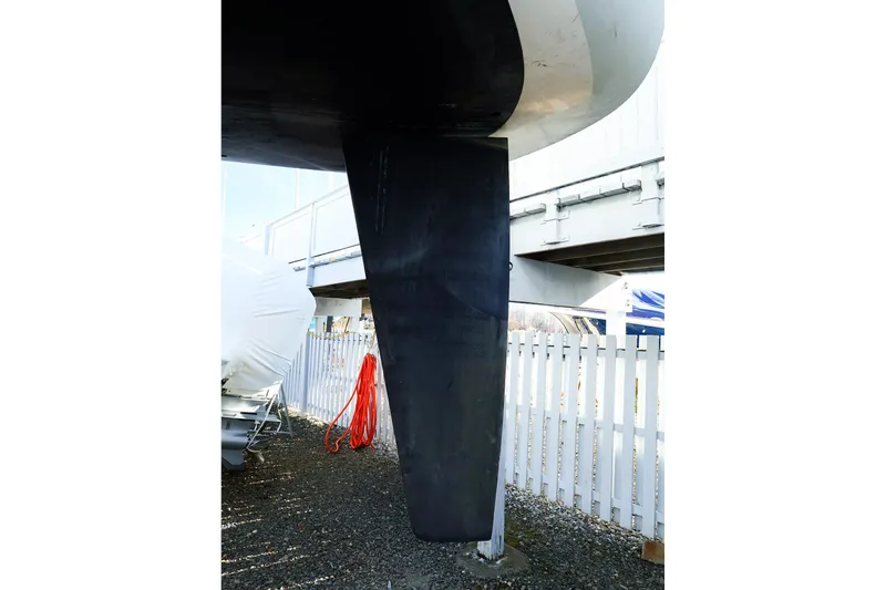 Slide: The Image of 2004 J Boats J/46 keel, displayed outdoors near a white fence. - 5