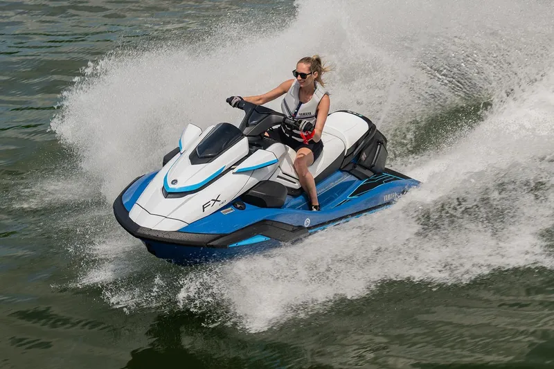 Slide: The Image of Manufacturer Provided Image: 2026 Yamaha WaveRunner FX HO jet ski speeding on water with rider. - 2