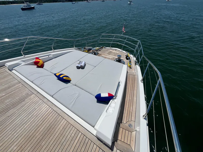 Slide: The Image of Luxurious 2019 Azimut Grande 27M yacht deck with sunbathing area and colorful cushions. - 15