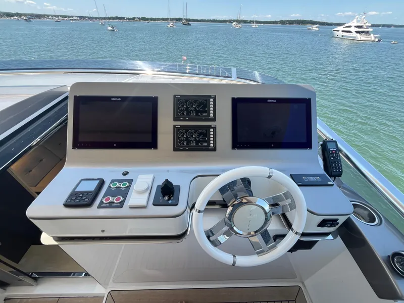 Slide: The Image of Helm of 2019 Azimut Grande 27M yacht with dual screens and steering wheel. - 29