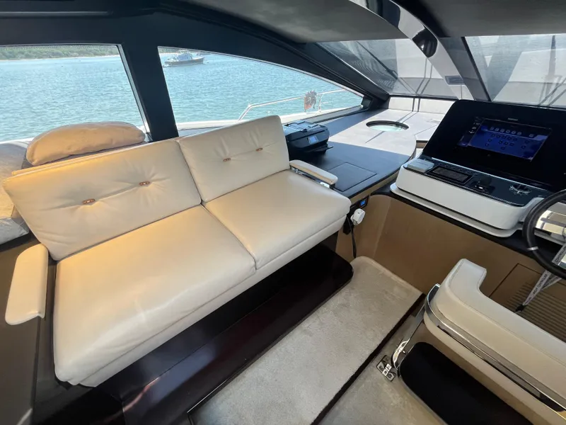 Slide: The Image of Luxurious interior of 2019 Azimut Grande 27M yacht with plush seating and modern controls. - 32