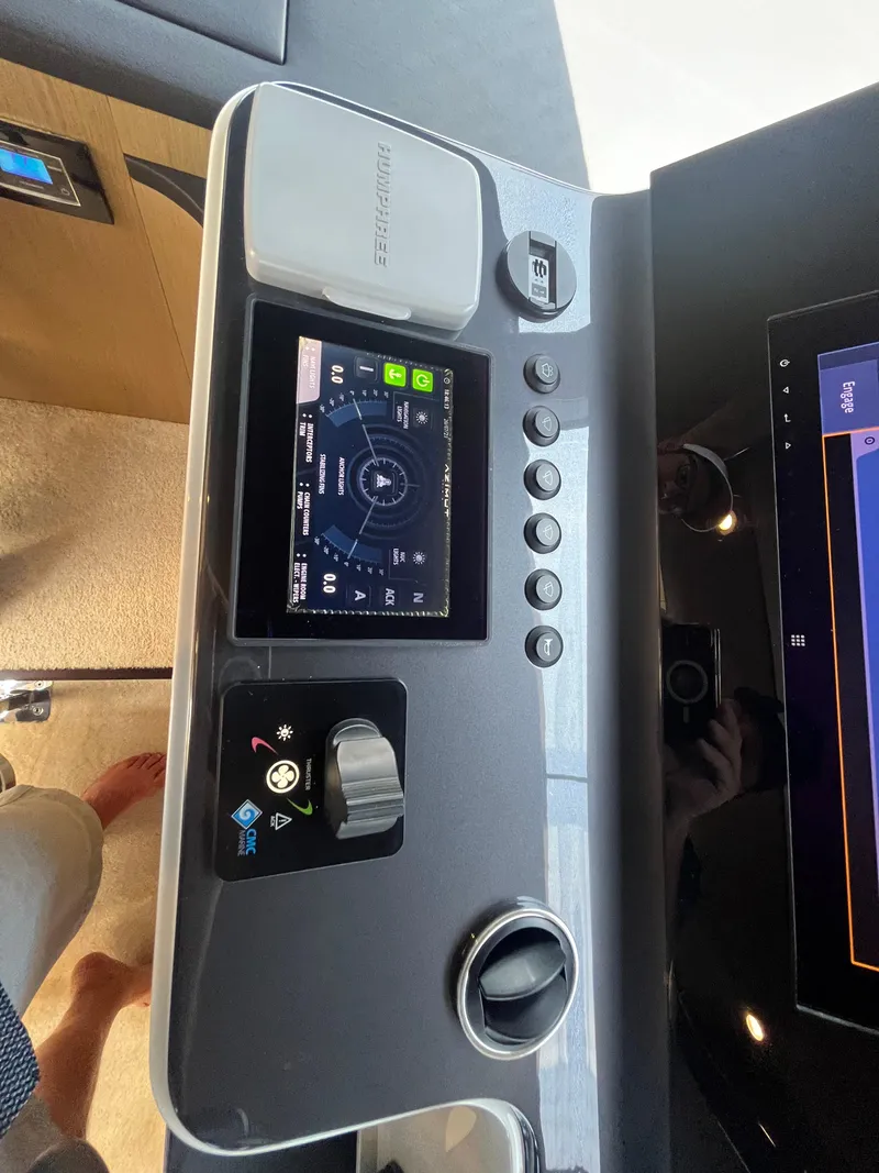Slide: The Image of Control panel of 2019 Azimut Grande 27M yacht with navigation display and controls. - 35