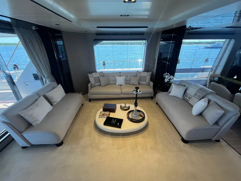 Slide: The Image of Luxurious interior of 2019 Azimut Grande 27M yacht with elegant seating and sea view. - 43
