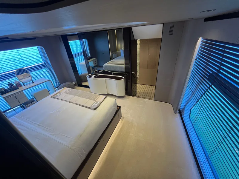Slide: The Image of Luxurious bedroom interior of 2019 Azimut Grande 27M yacht with modern design and large windows. - 45