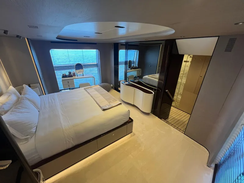 Slide: The Image of Luxurious bedroom interior of 2019 Azimut Grande 27M yacht with modern design and large windows. - 46