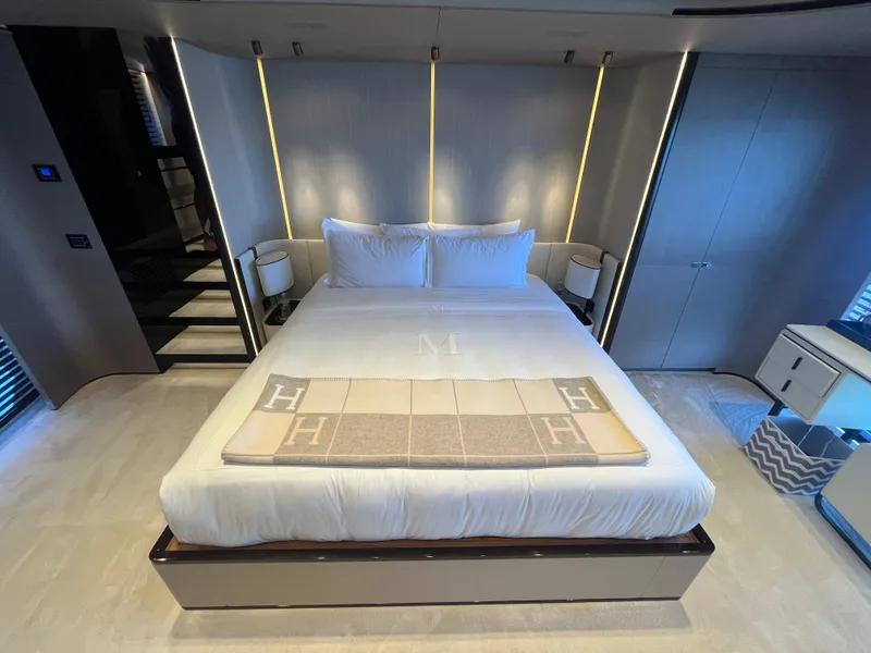 Slide: The Image of Luxurious bedroom interior of 2019 Azimut Grande 27M yacht with elegant bedding. - 48