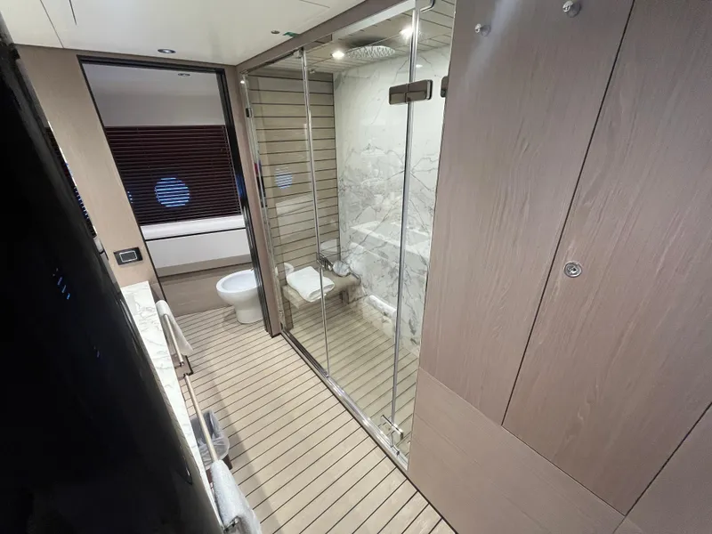 Slide: The Image of Luxurious bathroom on 2019 Azimut Grande 27M yacht with modern design and glass shower. - 49
