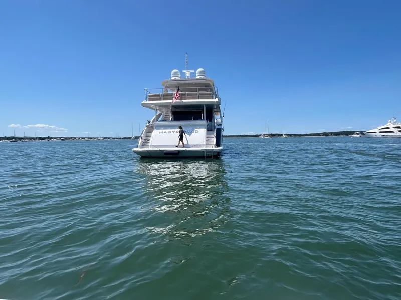Slide: The Image of Azimut Grande 27M yacht on water, 2019 model, clear blue sky background. - 6