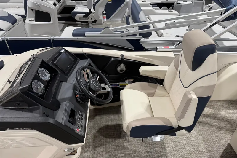 Slide: The Image of 2025 Avalon 2585 Catalina VRL boat interior with steering wheel and captain's chair. - 5