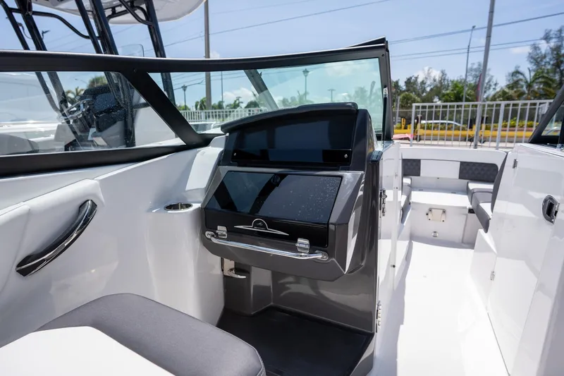 Slide: The Image of 2024 Monterey M-45 boat interior with sleek dashboard and seating area. - 12