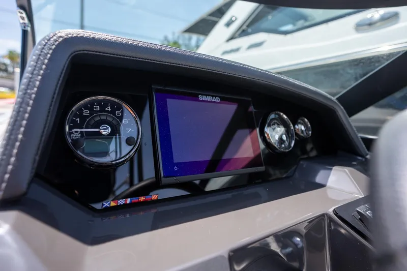 Slide: The Image of Dashboard of 2024 Monterey M-45 boat with Simrad display and RPM gauge. - 15