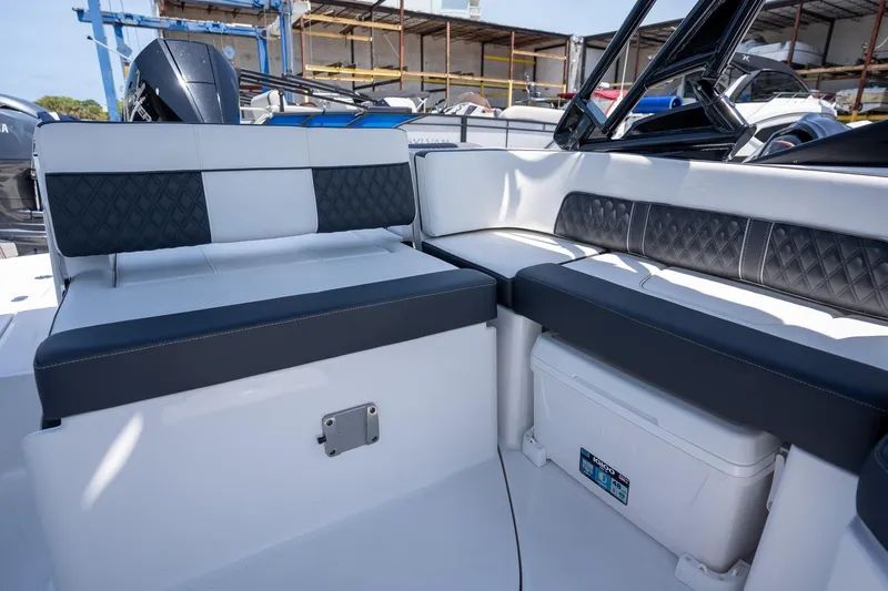 Slide: The Image of 2024 Monterey M-45 boat interior with cushioned seating and storage compartment. - 16